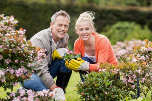 Gardening team assessing a site with signage